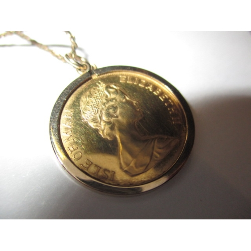 130 - A 1981 Isle of Man gold half sovereign in 9ct mount with yellow metal chain, approx. parcel weight 6... 