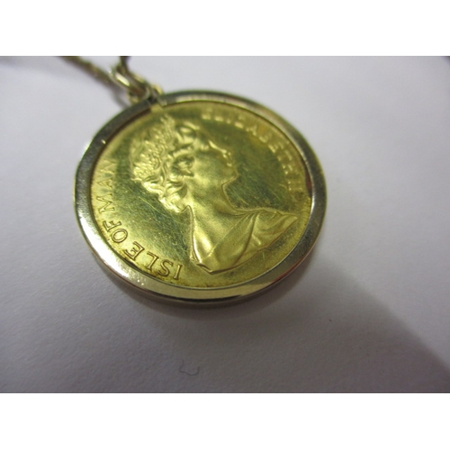 130 - A 1981 Isle of Man gold half sovereign in 9ct mount with yellow metal chain, approx. parcel weight 6... 