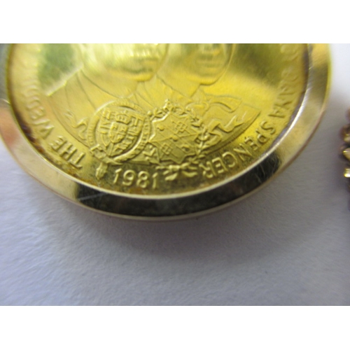 130 - A 1981 Isle of Man gold half sovereign in 9ct mount with yellow metal chain, approx. parcel weight 6... 