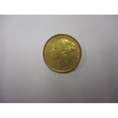 131 - An 1883 young head Victoria gold sovereign, a circulated coins with reasonable definition of feature... 