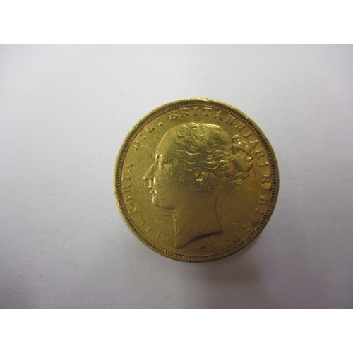 131 - An 1883 young head Victoria gold sovereign, a circulated coins with reasonable definition of feature... 