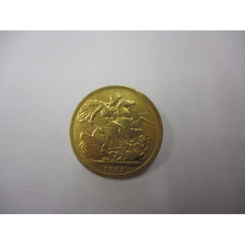 131 - An 1883 young head Victoria gold sovereign, a circulated coins with reasonable definition of feature... 