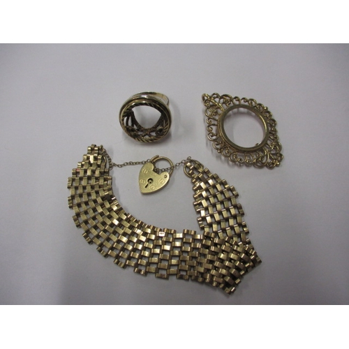 76 - A parcel of gold and yellow metal items, to include a gate bracelet, approx. parcel weight 28g, all ... 