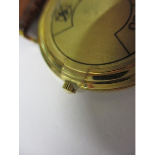 115 - A 1990s Omega 18ct gold cased watch, with date window, in unused condition and still retaining prote... 