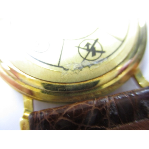 115 - A 1990s Omega 18ct gold cased watch, with date window, in unused condition and still retaining prote... 