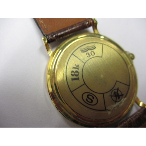 115 - A 1990s Omega 18ct gold cased watch, with date window, in unused condition and still retaining prote... 