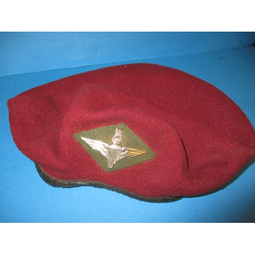 218 - A 1944 parachute regiment maroon Kangol beret and cap badge, 7th light infantry, in good used condit... 