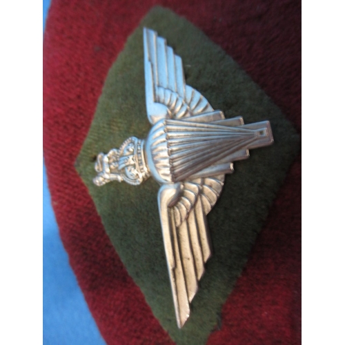 218 - A 1944 parachute regiment maroon Kangol beret and cap badge, 7th light infantry, in good used condit... 