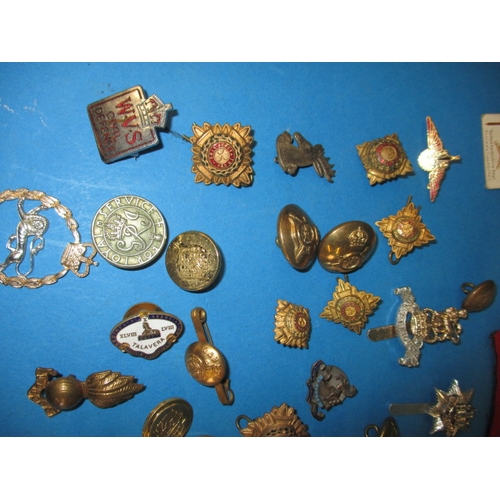 219 - A parcel of WWII and later military and civilian insignia and some replica medals, all in used condi... 