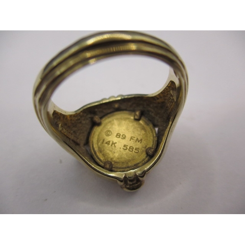 44 - An Egyptian ring with central coin medallion marked 14k, approx. ring size ‘N’ approx. weight 7.4g, ... 