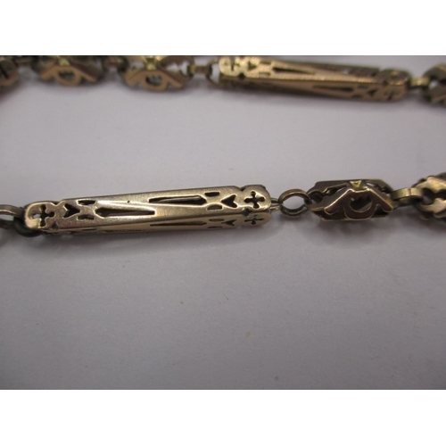 83 - An antique 9ct gold watch chain, approx. weight 25.5g, used condition with a broken link