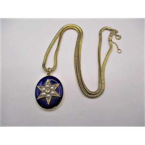 96 - An 18ct gold and blue enamel pendant, having a central star motif set with diamonds and pearls, with... 