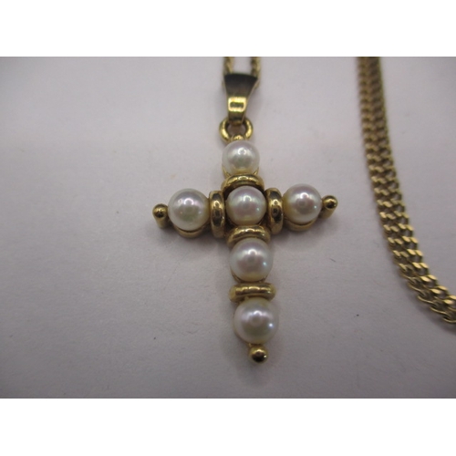 98 - A 9ct gold necklace and pendant in the form of a cross set with pearls, approx. linear length 52cm, ... 