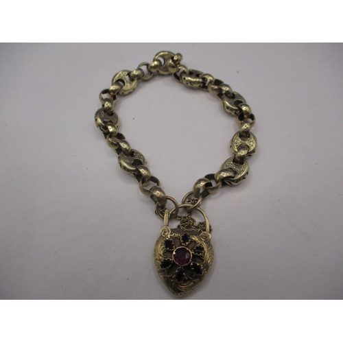 102 - An unmarked yellow metal bracelet, set with various stones to locket clasp, approx. weight 19.6g in ... 