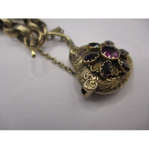 102 - An unmarked yellow metal bracelet, set with various stones to locket clasp, approx. weight 19.6g in ... 