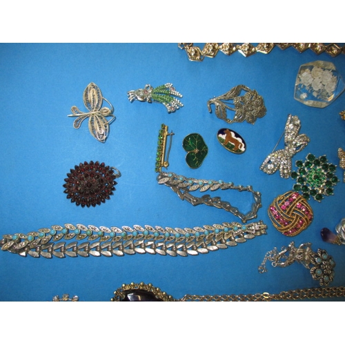 176 - A large quantity of antique and later costume jewellery, to include some silver items, all in used c... 