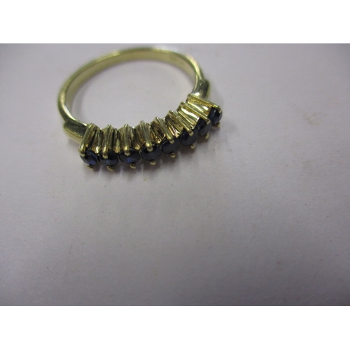 12 - A yellow gold dress ring marked 585, set with 5 blue sapphires, approx. ring size ‘L’ approx. weight... 