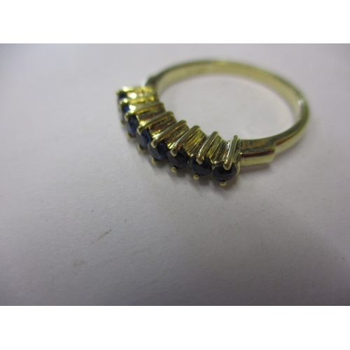 12 - A yellow gold dress ring marked 585, set with 5 blue sapphires, approx. ring size ‘L’ approx. weight... 