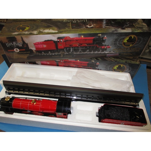 328 - Two Harry Potter Hogwarts Express 1:50 scale die-cast models, each in original boxed condition