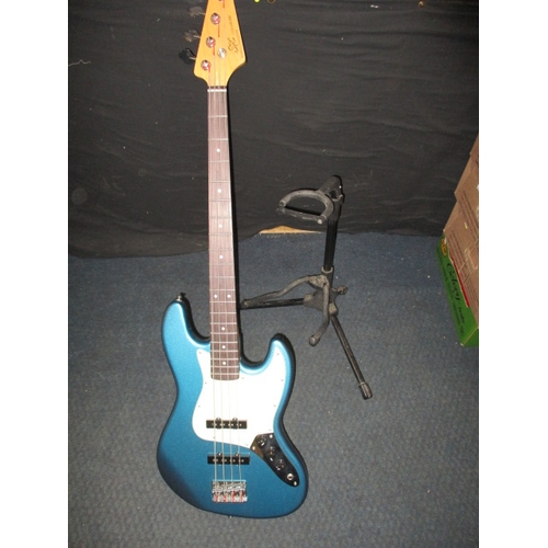 310 - A SX VTG series custom handmade electric bass guitar, with stand. In pre-owned condition