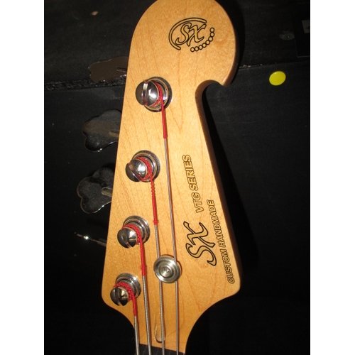 310 - A SX VTG series custom handmade electric bass guitar, with stand. In pre-owned condition