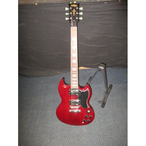 312 - A ‘Vintage’ electric guitar with Wilkinson pick ups. With light weight case and stand. In pre-owned ... 