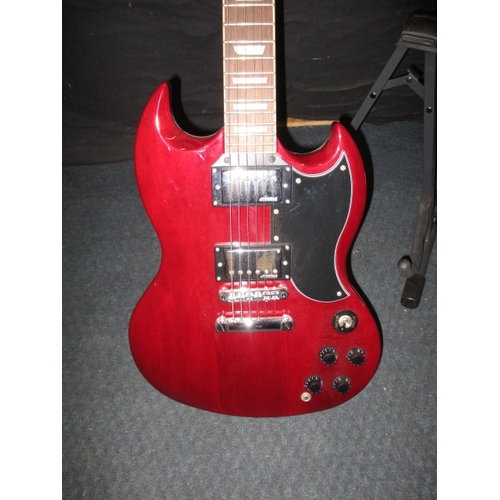 312 - A ‘Vintage’ electric guitar with Wilkinson pick ups. With light weight case and stand. In pre-owned ... 