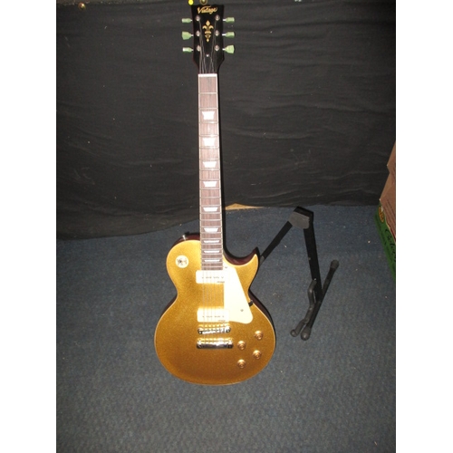 313 - A ‘Vintage’ electric guitar with Wilkinson pick ups and stand. In pre-owned condition