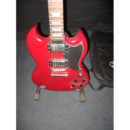 317 - A ‘Chord’ CSG61 electric guitar, with soft carry case and stand. In pre-owned condition