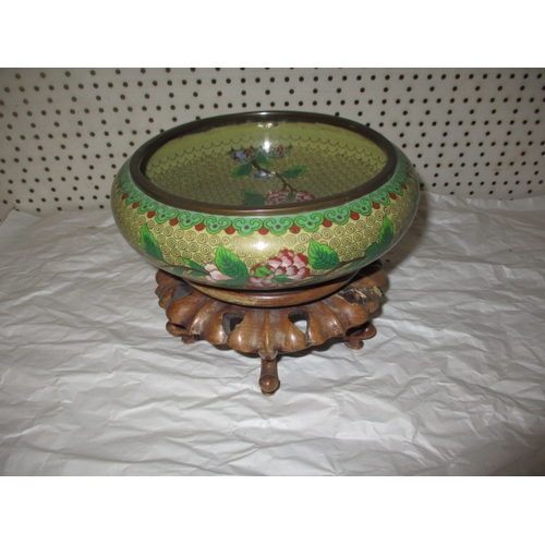 An antique cloisonne bowl on carved wood stand, approx. diameter 20cm, in good pre-owned condition with no observed damage or restoration, stand has repairs