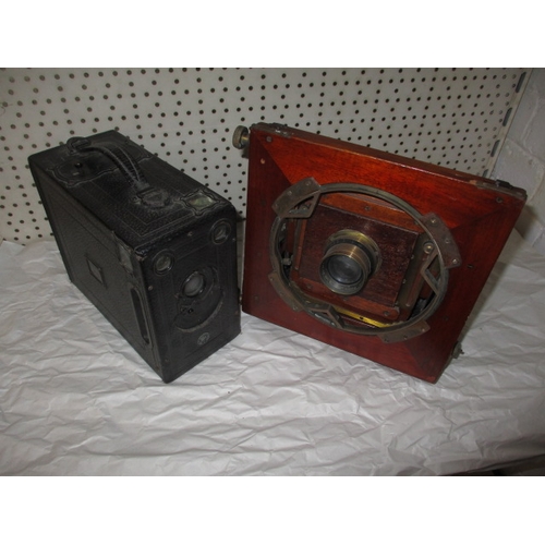 295 - An antique plate camera and one other, both in well used condition and not tested as to function