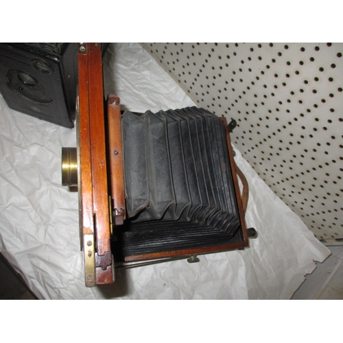 295 - An antique plate camera and one other, both in well used condition and not tested as to function