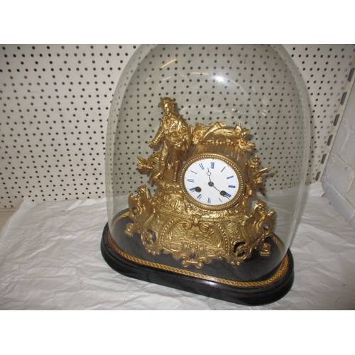 235 - A vintage continental 2 trail mantle clock, with gilt painted metal case under glass dome, no key so... 