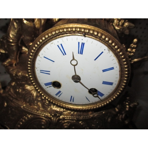 235 - A vintage continental 2 trail mantle clock, with gilt painted metal case under glass dome, no key so... 