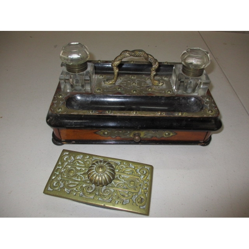 298 - An Edwardian two bottle standish and a brass mounted blotter, all in used condition with general use... 