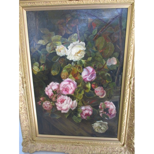 243 - An antique oil on canvas floral painting, approx. image size 65x45cm having had repairs and in later... 