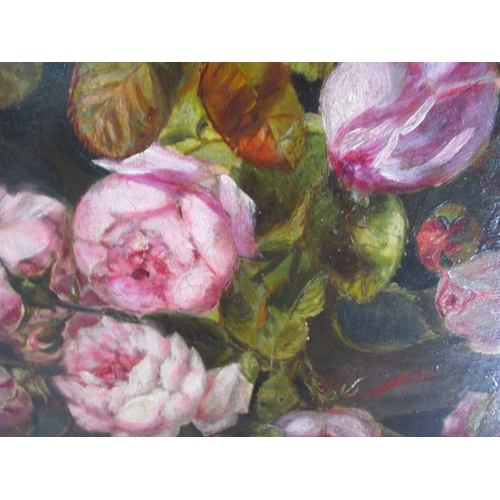 243 - An antique oil on canvas floral painting, approx. image size 65x45cm having had repairs and in later... 