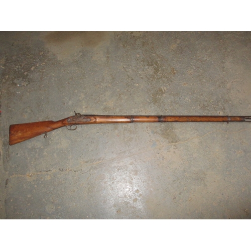 225 - A 19th century percussion musket, with working lock, approx. length 146cm in well used condition