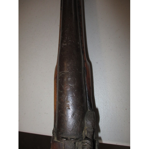 225 - A 19th century percussion musket, with working lock, approx. length 146cm in well used condition