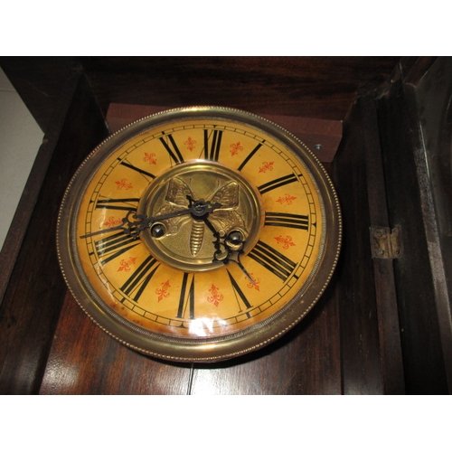 240 - A vintage oak cased wall clock, approx. length 93cm, having use-related marks runs when wound