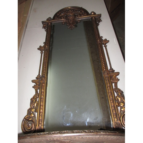 300 - A large vintage decorative cast iron wall mirror with lower shelf, in useable pre-owned condition, a... 