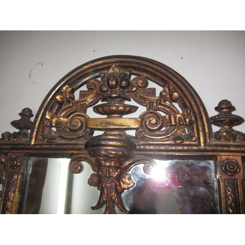 300 - A large vintage decorative cast iron wall mirror with lower shelf, in useable pre-owned condition, a... 