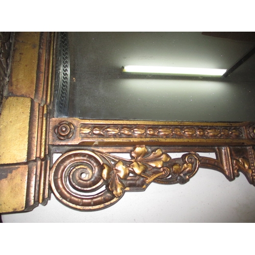 300 - A large vintage decorative cast iron wall mirror with lower shelf, in useable pre-owned condition, a... 