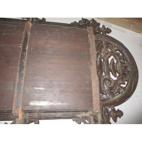 300 - A large vintage decorative cast iron wall mirror with lower shelf, in useable pre-owned condition, a... 