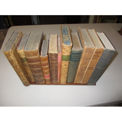 302 - A vintage brass mounted book slide with a quantity of old books, in useable pre-owned condition