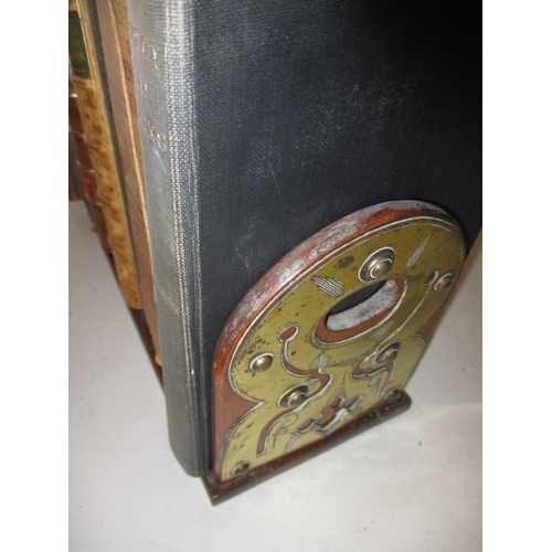 302 - A vintage brass mounted book slide with a quantity of old books, in useable pre-owned condition