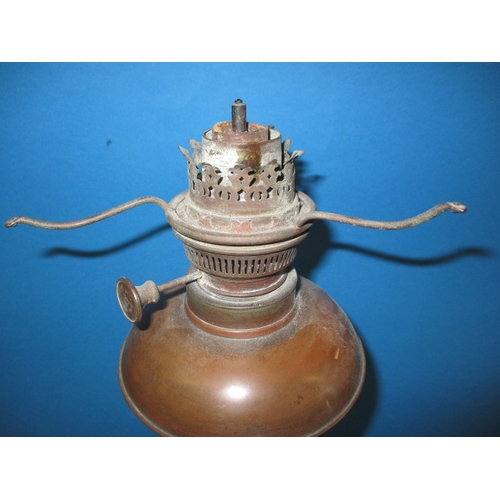 306 - An antique cast iron figural oil lamp, having copper reservoir, use and age related marks, no shade