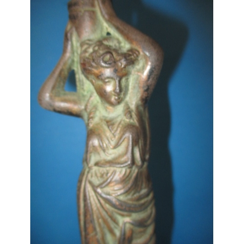 306 - An antique cast iron figural oil lamp, having copper reservoir, use and age related marks, no shade