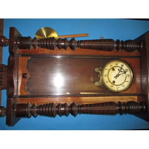 241 - An early 20th century mahogany cased wall clock, in current working order, approx. length 83cm, havi... 