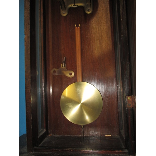 241 - An early 20th century mahogany cased wall clock, in current working order, approx. length 83cm, havi... 